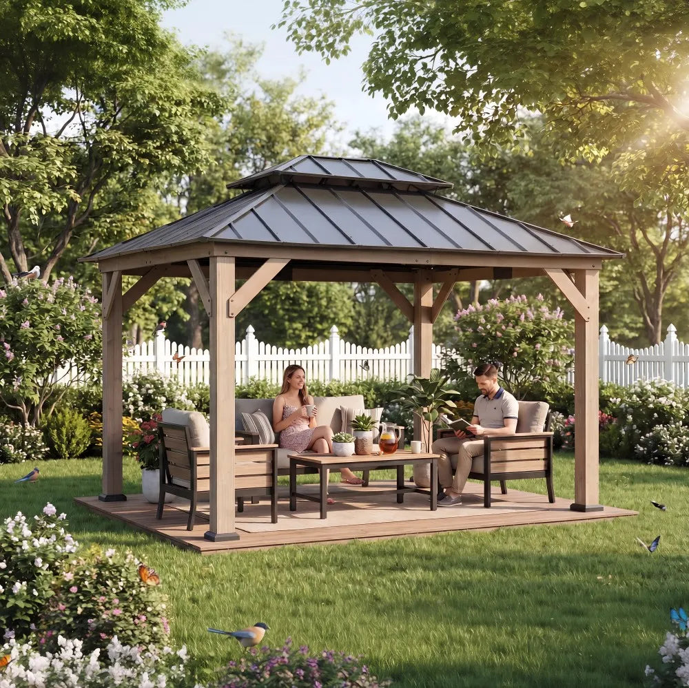 Two people sitting under a wooden gazebo in a garden setting with trees and flowers.